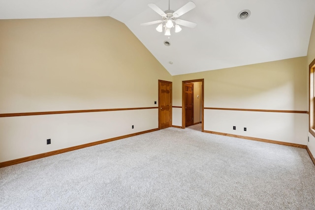 4255 Mcfall Rd, Cumberland City, TN 37050 - spare room with light colored carpet, ceiling fan, and high vaulted ceiling