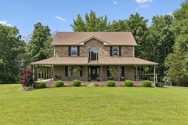 4255 Mcfall Rd, Cumberland City, TN 37050 - view of front of house featuring covered porch, a front lawn, a storage shed, and a shingled roof