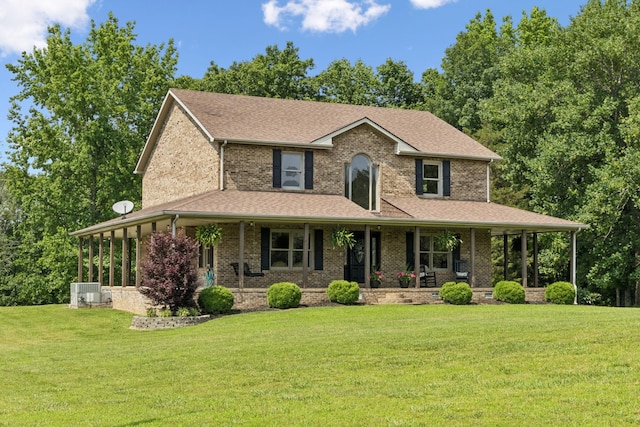 4255 Mcfall Rd, Cumberland City, TN 37050 - country-style home featuring covered porch, a front yard, and a shingled roof