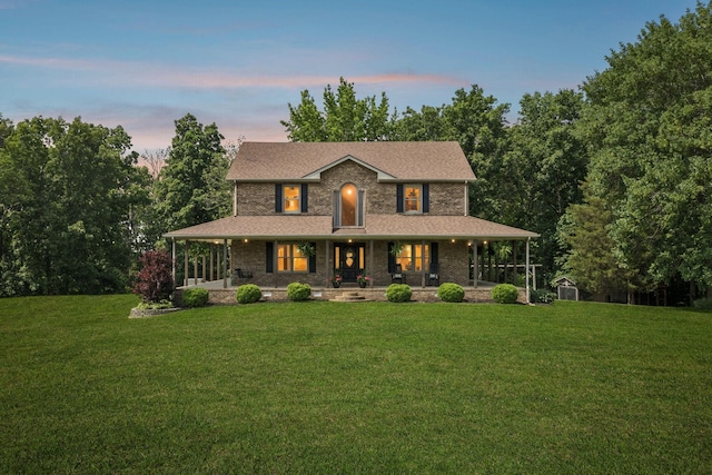 4255 Mcfall Rd, Cumberland City, TN 37050 - view of front of property featuring a lawn and covered porch
