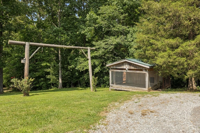4255 Mcfall Rd, Cumberland City, TN 37050 - view of green lawn with an outdoor structure and exterior structure