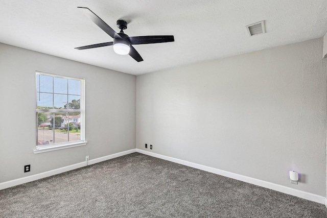 180 Bill Stewart Blvd, La Vergne, TN 37086 - empty room featuring dark carpet and a ceiling fan