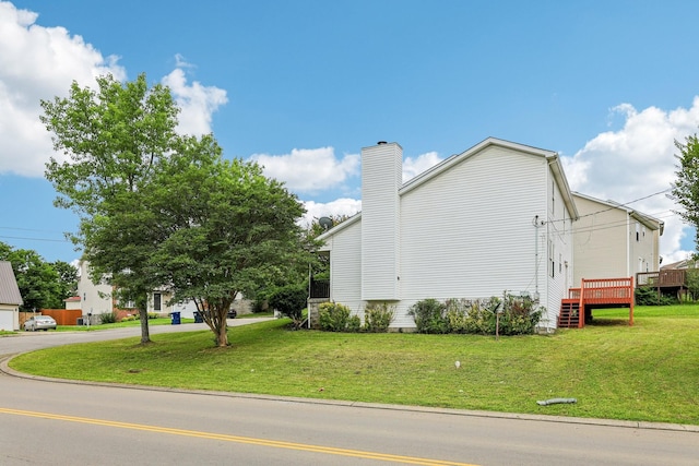 180 Bill Stewart Blvd, La Vergne, TN 37086 - view of property exterior featuring a yard, a chimney, and a deck