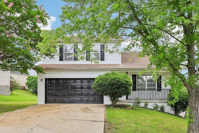 180 Bill Stewart Blvd, La Vergne, TN 37086 - view of front of property with concrete driveway, a front yard, and an attached garage