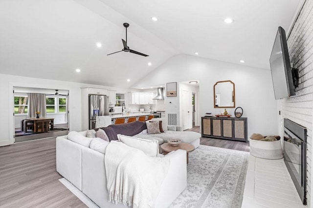 5171 Whites Creek Pike, Whites Creek, TN 37189 - living area with ceiling fan, a fireplace, light wood-style floors, recessed lighting, and high vaulted ceiling