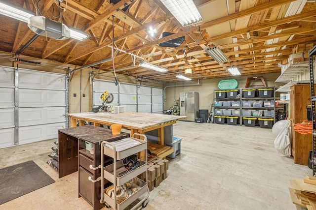 204 Eldon Ct, Nashville, TN 37214 - garage featuring a garage door opener and stainless steel fridge