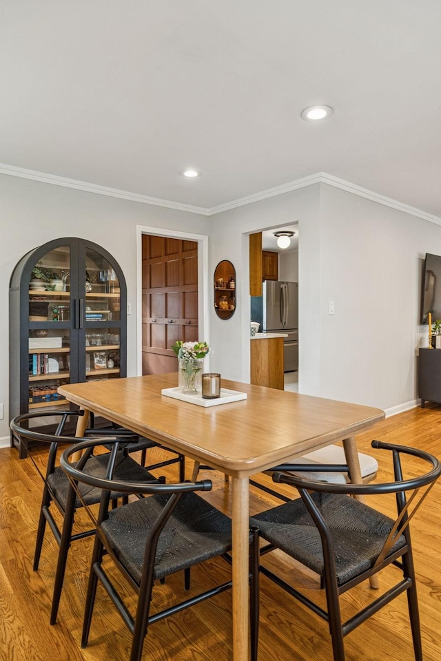 204 Eldon Ct, Nashville, TN 37214 - dining area featuring light wood-type flooring, recessed lighting, and crown molding