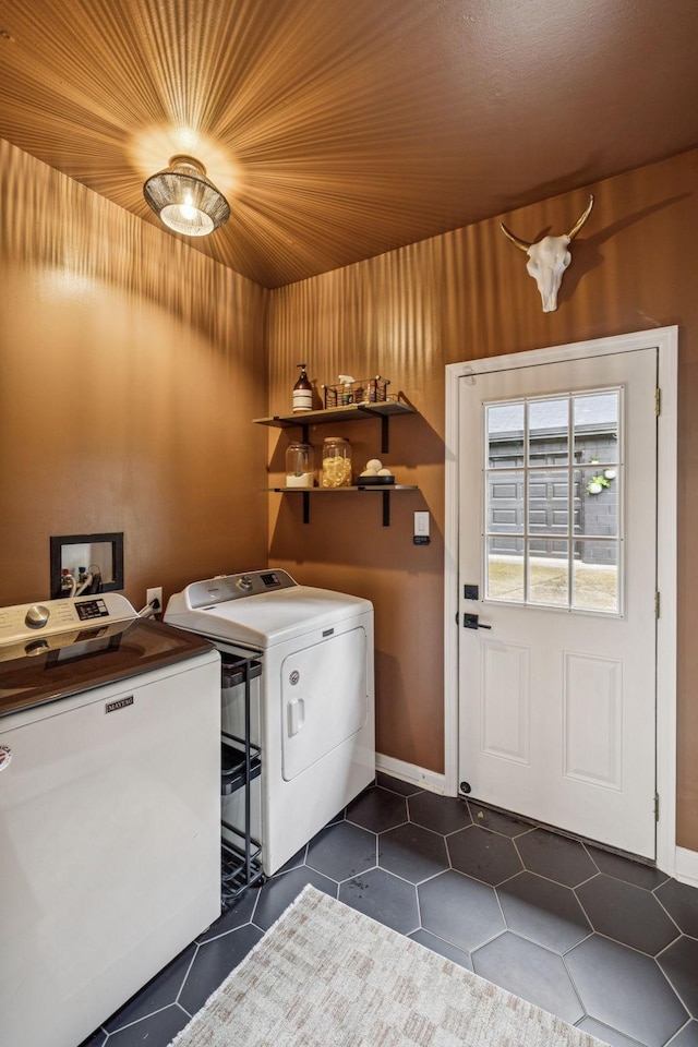 204 Eldon Ct, Nashville, TN 37214 - laundry area with washing machine and dryer and dark tile patterned flooring