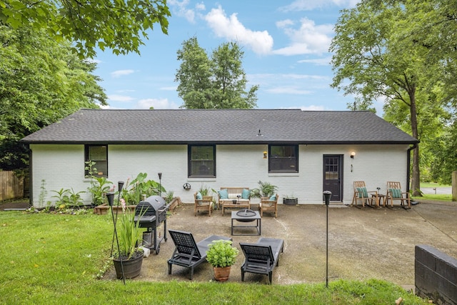 204 Eldon Ct, Nashville, TN 37214 - back of house featuring an outdoor hangout area, a patio, a lawn, brick siding, and a shingled roof