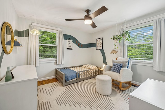 204 Eldon Ct, Nashville, TN 37214 - bedroom with wood finished floors, a crib, and a ceiling fan