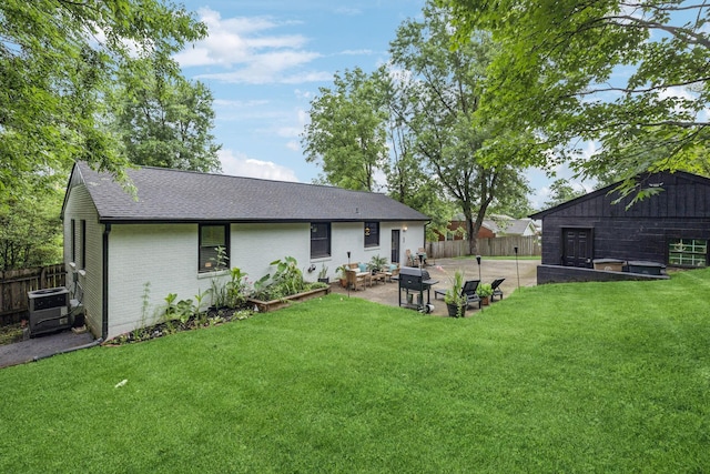 204 Eldon Ct, Nashville, TN 37214 - back of house with a fenced backyard, a patio, roof with shingles, and brick siding