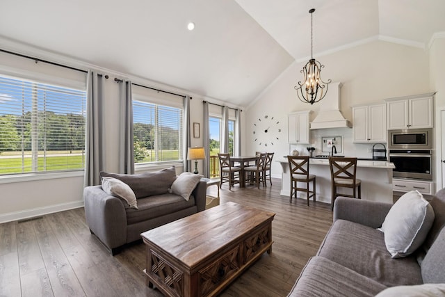 623 Josef Cir, Columbia, TN 38401 - living room featuring a chandelier, ornamental molding, dark wood finished floors, and high vaulted ceiling