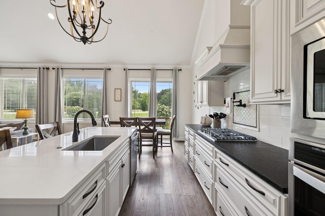 623 Josef Cir, Columbia, TN 38401 - kitchen with stainless steel appliances, premium range hood, backsplash, lofted ceiling, and dark wood-type flooring