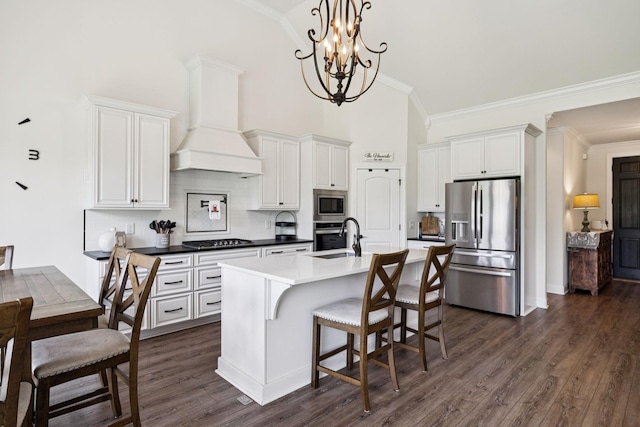 623 Josef Cir, Columbia, TN 38401 - kitchen featuring appliances with stainless steel finishes, custom exhaust hood, backsplash, white cabinetry, and dark wood-type flooring