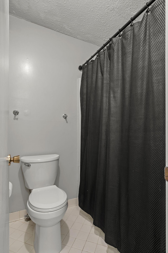 1029 Rachels Square Dr, Hermitage, TN 37076 - full bath with tile patterned floors, a textured ceiling, and a shower with curtain