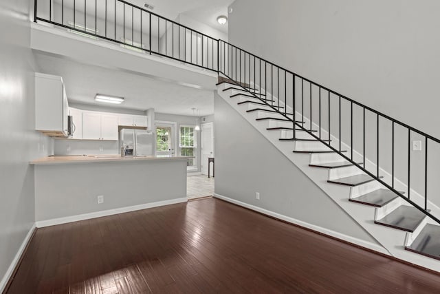 1029 Rachels Square Dr, Hermitage, TN 37076 - stairway with hardwood / wood-style floors and a towering ceiling