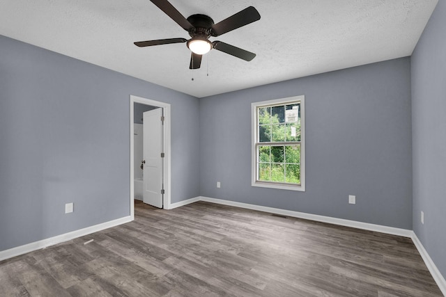 128 N C St, Hillsboro, TN 37342 - spare room featuring wood finished floors, a textured ceiling, and a ceiling fan