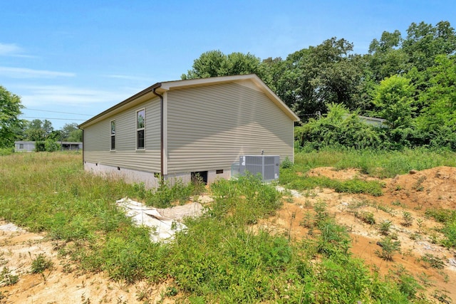 128 N C St, Hillsboro, TN 37342 - view of home's exterior featuring crawl space and a central AC unit