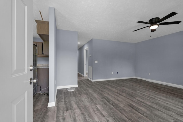 128 N C St, Hillsboro, TN 37342 - unfurnished room with dark wood finished floors, ceiling fan, and a textured ceiling
