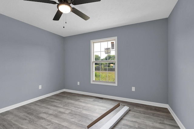 128 N C St, Hillsboro, TN 37342 - spare room featuring wood finished floors and a ceiling fan