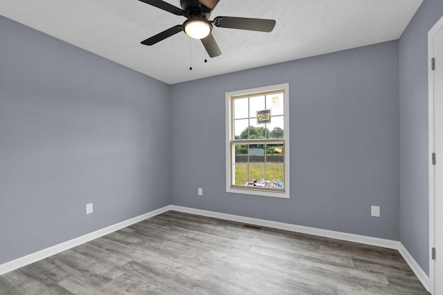 128 N C St, Hillsboro, TN 37342 - unfurnished room with wood finished floors, a ceiling fan, and a textured ceiling