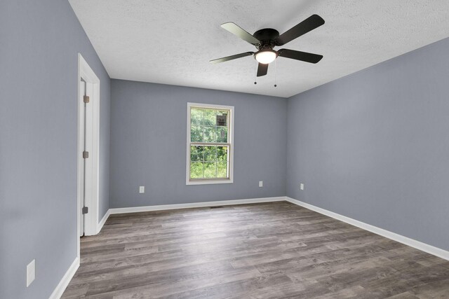 128 N C St, Hillsboro, TN 37342 - empty room with a ceiling fan, a textured ceiling, and wood finished floors