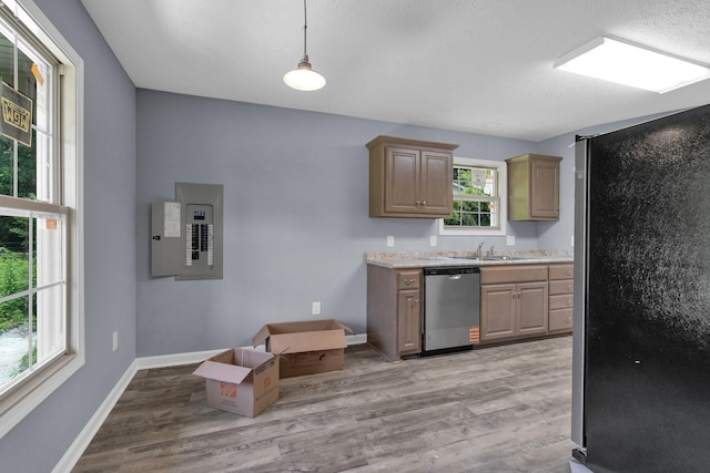 128 N C St, Hillsboro, TN 37342 - kitchen with appliances with stainless steel finishes, electric panel, light countertops, light wood-style floors, and hanging light fixtures