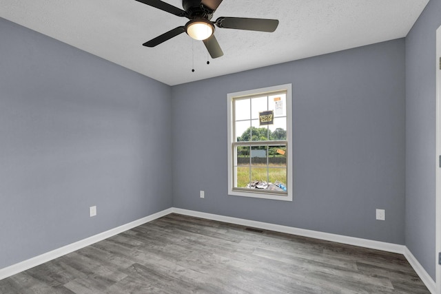 128 N C St, Hillsboro, TN 37342 - spare room with wood finished floors, a ceiling fan, and a textured ceiling
