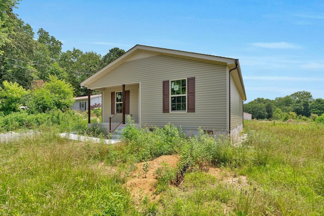 128 N C St, Hillsboro, TN 37342 - view of front of house with covered porch and crawl space