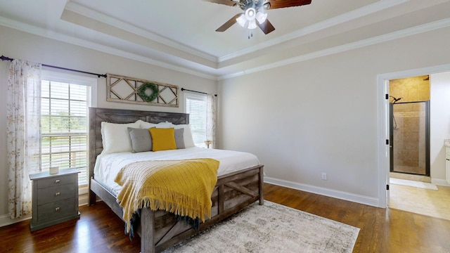 15505 Versailles Rd, Rockvale, TN 37153 - bedroom with wood finished floors, crown molding, a tray ceiling, a ceiling fan, and connected bathroom