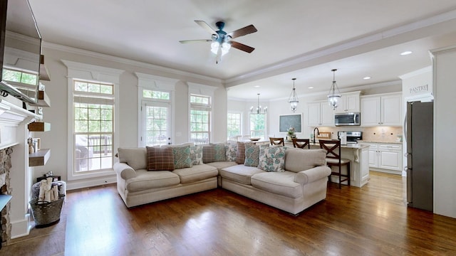 15505 Versailles Rd, Rockvale, TN 37153 - living area featuring ceiling fan, a fireplace with raised hearth, dark wood-type flooring, crown molding, and recessed lighting