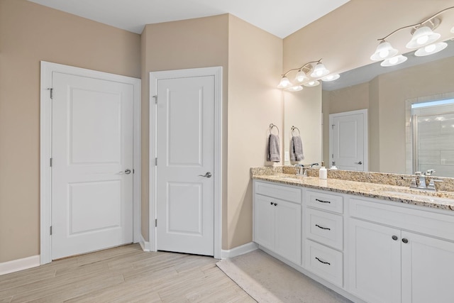 2213 Kirkwall Dr, Nolensville, TN 37135 - full bath with double vanity, a stall shower, and wood finished floors