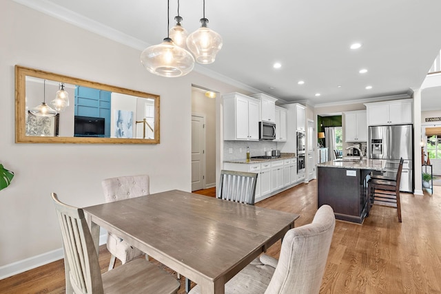 2213 Kirkwall Dr, Nolensville, TN 37135 - dining area featuring crown molding, light wood-style floors, and recessed lighting