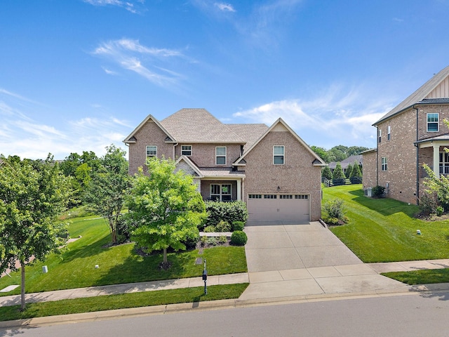 2213 Kirkwall Dr, Nolensville, TN 37135 - craftsman-style house featuring an attached garage, driveway, brick siding, and a front yard