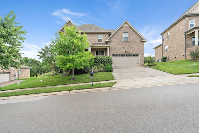 2213 Kirkwall Dr, Nolensville, TN 37135 - view of front of house with an attached garage, driveway, a front yard, and brick siding