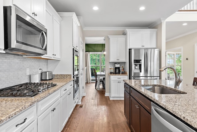 2213 Kirkwall Dr, Nolensville, TN 37135 - kitchen featuring appliances with stainless steel finishes, healthy amount of natural light, white cabinets, crown molding, and recessed lighting