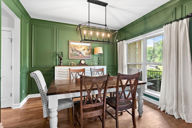 2213 Kirkwall Dr, Nolensville, TN 37135 - dining area with a decorative wall, dark wood-style floors, and a chandelier