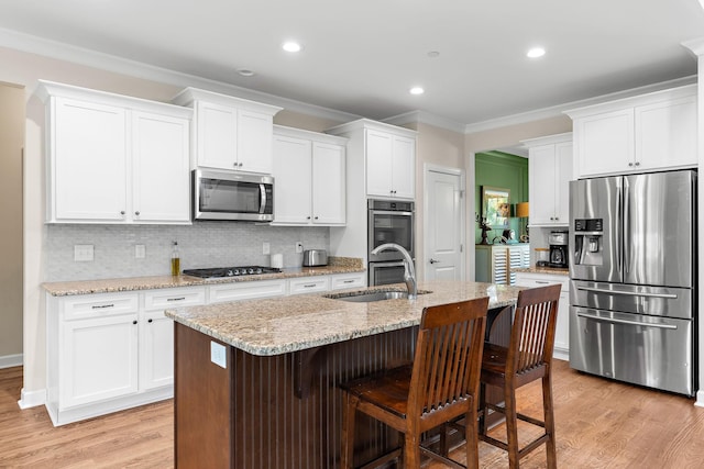 2213 Kirkwall Dr, Nolensville, TN 37135 - kitchen featuring stainless steel appliances, ornamental molding, white cabinets, backsplash, and recessed lighting
