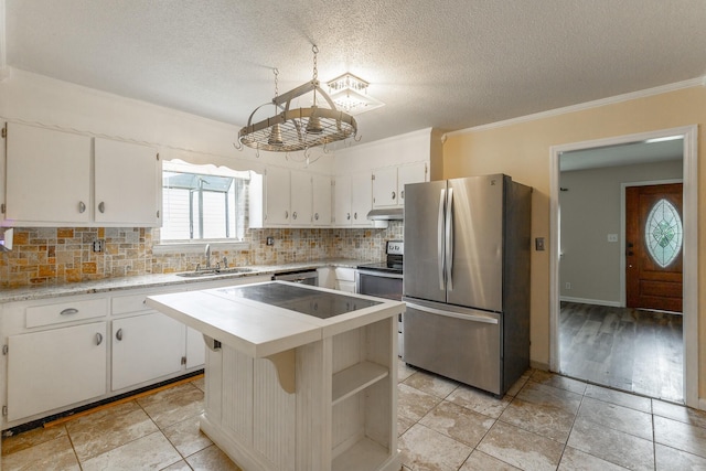 3405 Elder Mountain Rd, Chattanooga, TN 37419 - kitchen with freestanding refrigerator, light countertops, a chandelier, decorative backsplash, and crown molding