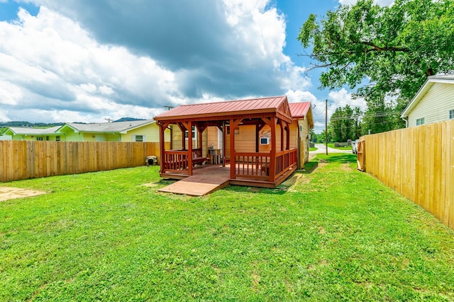 3405 Elder Mountain Rd, Chattanooga, TN 37419 - rear view of property with a fenced backyard, a deck, and a metal roof