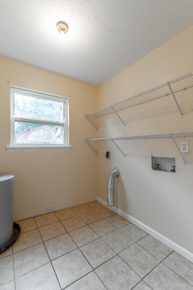 3405 Elder Mountain Rd, Chattanooga, TN 37419 - laundry area featuring hookup for a washing machine, light tile patterned floors, and a textured ceiling