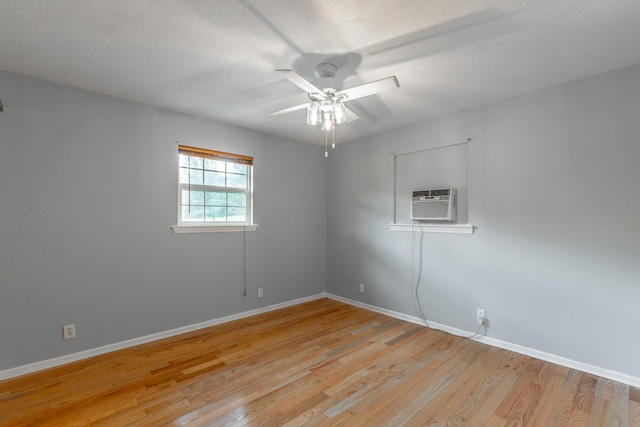 3405 Elder Mountain Rd, Chattanooga, TN 37419 - spare room with ceiling fan, light wood-style flooring, a wall unit AC, and a textured ceiling