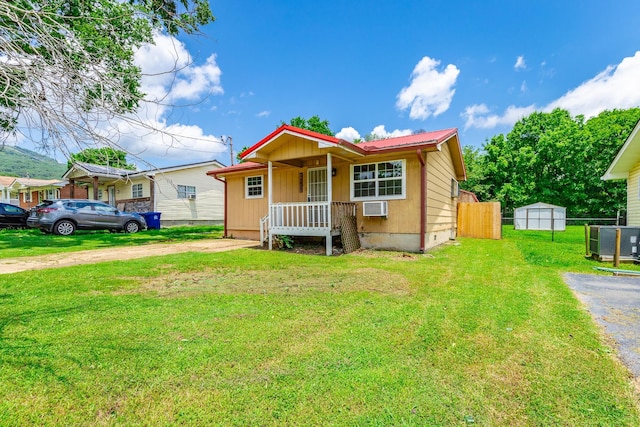 3405 Elder Mountain Rd, Chattanooga, TN 37419 - view of front facade featuring dirt driveway, a wall unit AC, board and batten siding, and a metal roof