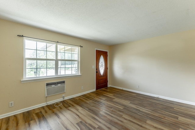 3405 Elder Mountain Rd, Chattanooga, TN 37419 - entrance foyer with wood finished floors, a textured ceiling, and an AC wall unit