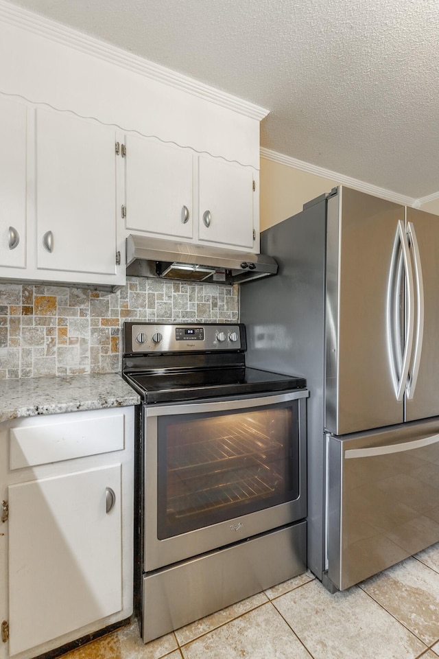 3405 Elder Mountain Rd, Chattanooga, TN 37419 - kitchen with appliances with stainless steel finishes, under cabinet range hood, ornamental molding, white cabinetry, and light tile patterned floors