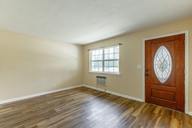 3405 Elder Mountain Rd, Chattanooga, TN 37419 - entrance foyer with wood finished floors, a textured ceiling, and a wall mounted air conditioner