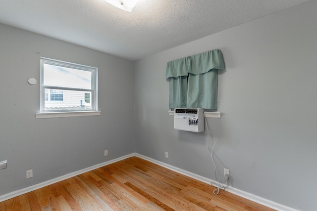 3405 Elder Mountain Rd, Chattanooga, TN 37419 - unfurnished room with light wood finished floors, cooling unit, and a textured ceiling