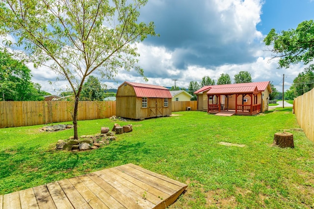 3405 Elder Mountain Rd, Chattanooga, TN 37419 - fenced backyard featuring a wooden deck and a storage unit