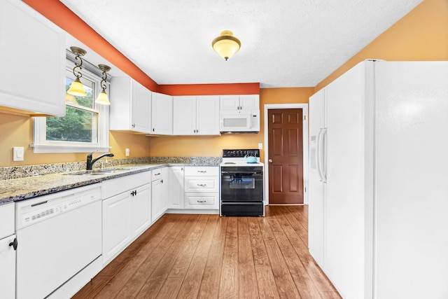 19 Garth Dr, Clarksville, TN 37040 - kitchen with white appliances, white cabinetry, light wood-style floors, and decorative light fixtures