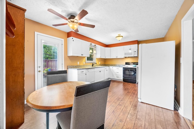 19 Garth Dr, Clarksville, TN 37040 - kitchen featuring white appliances, ceiling fan, white cabinetry, a textured ceiling, and light wood-style floors